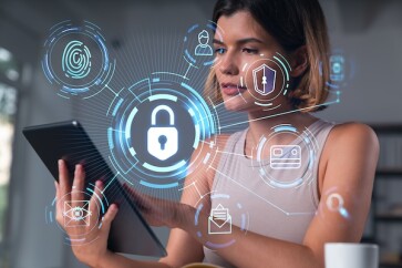 Smiling,Businesswoman,In,Casual,Wear,Holding,Tablet,Device,Touching,It